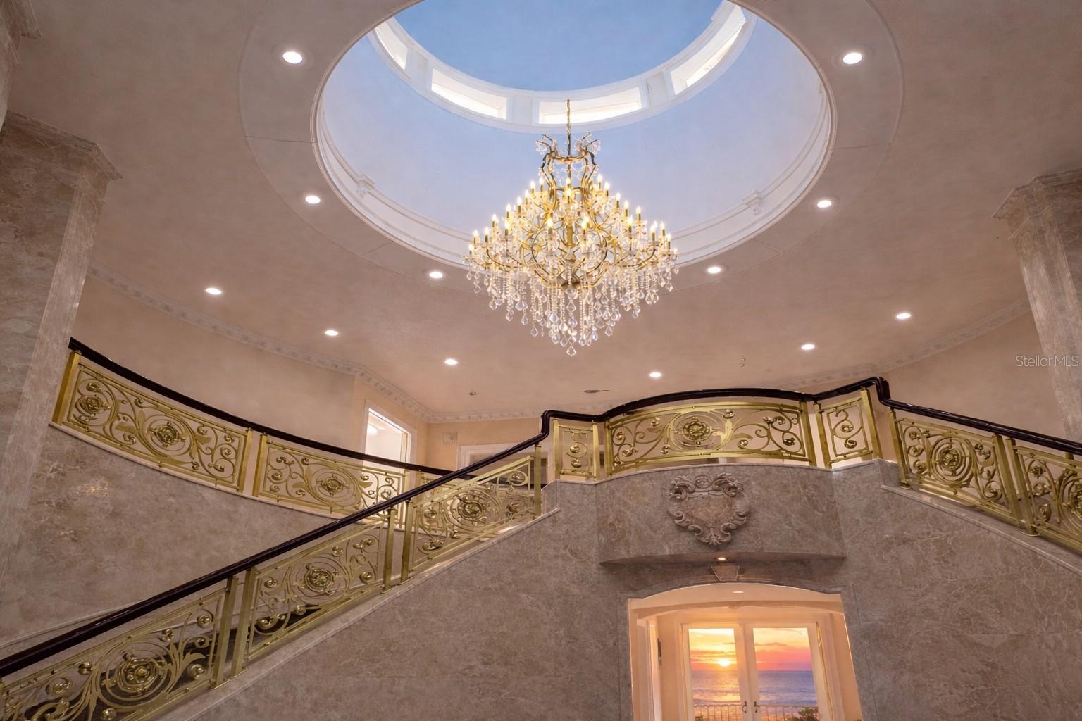 A stunning dome and rotunda anchor the home as its architectural centerpiece.