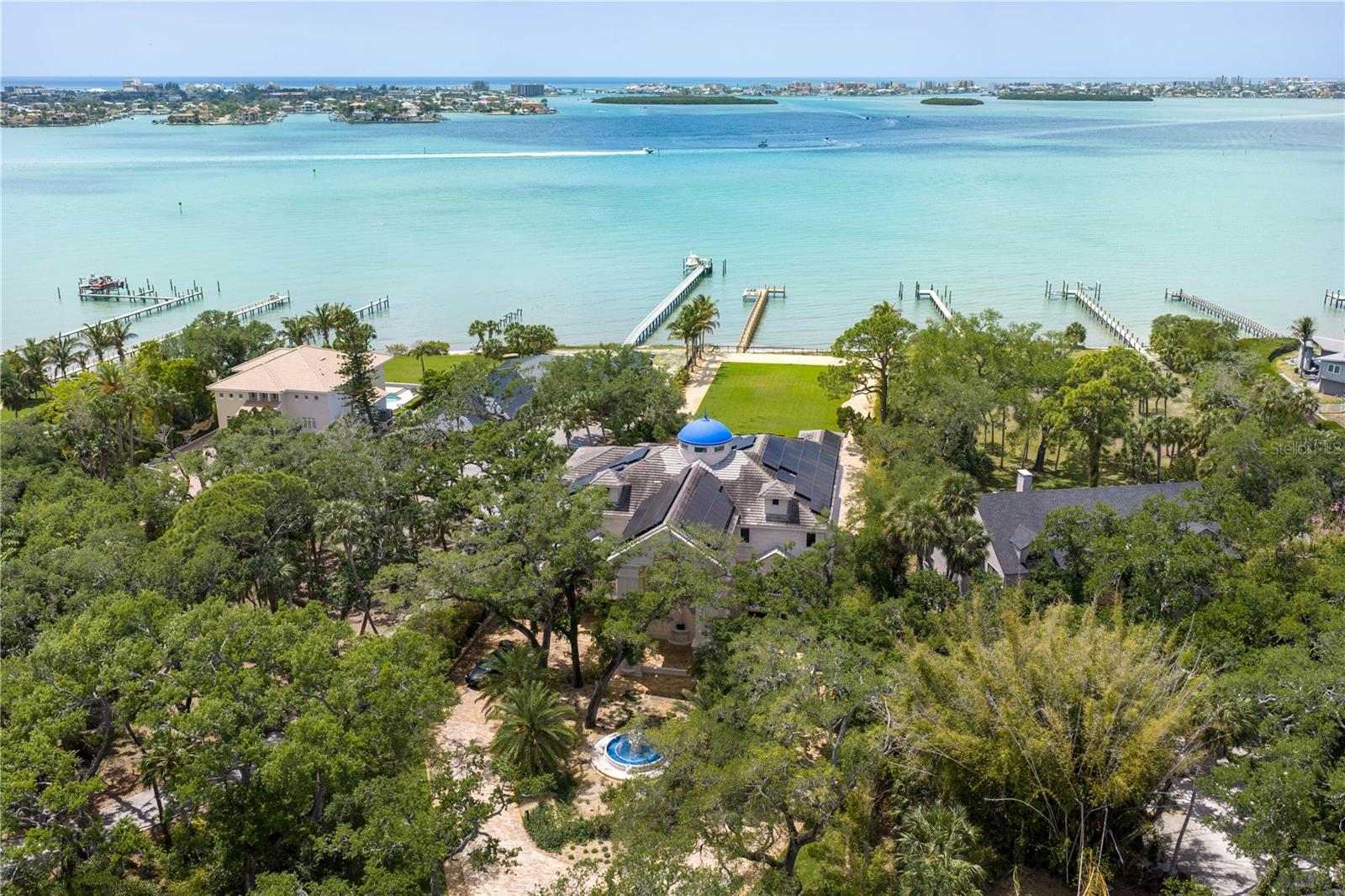 Private, gated setting surrounded by lush tropical landscaping.