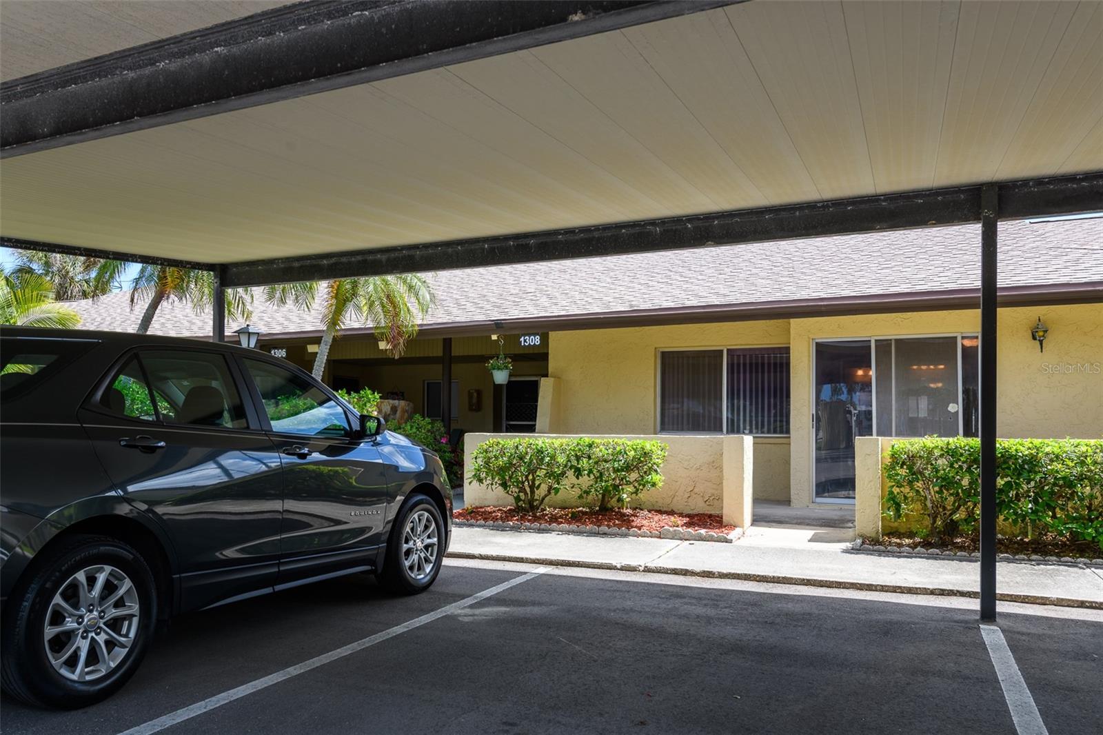 Carport outside front door.