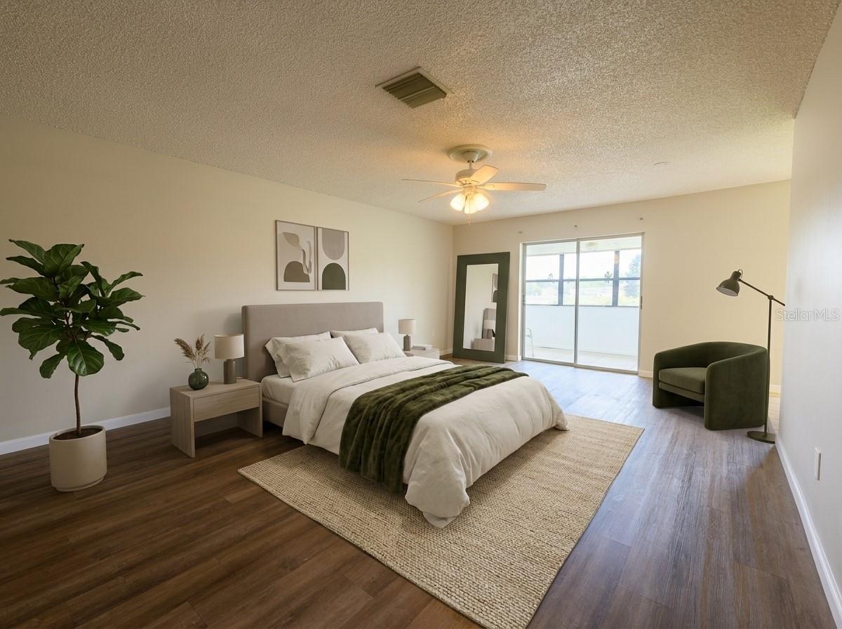 Master bedroom, sliding door to front patio. Wing has master bathroom, walk in closet.