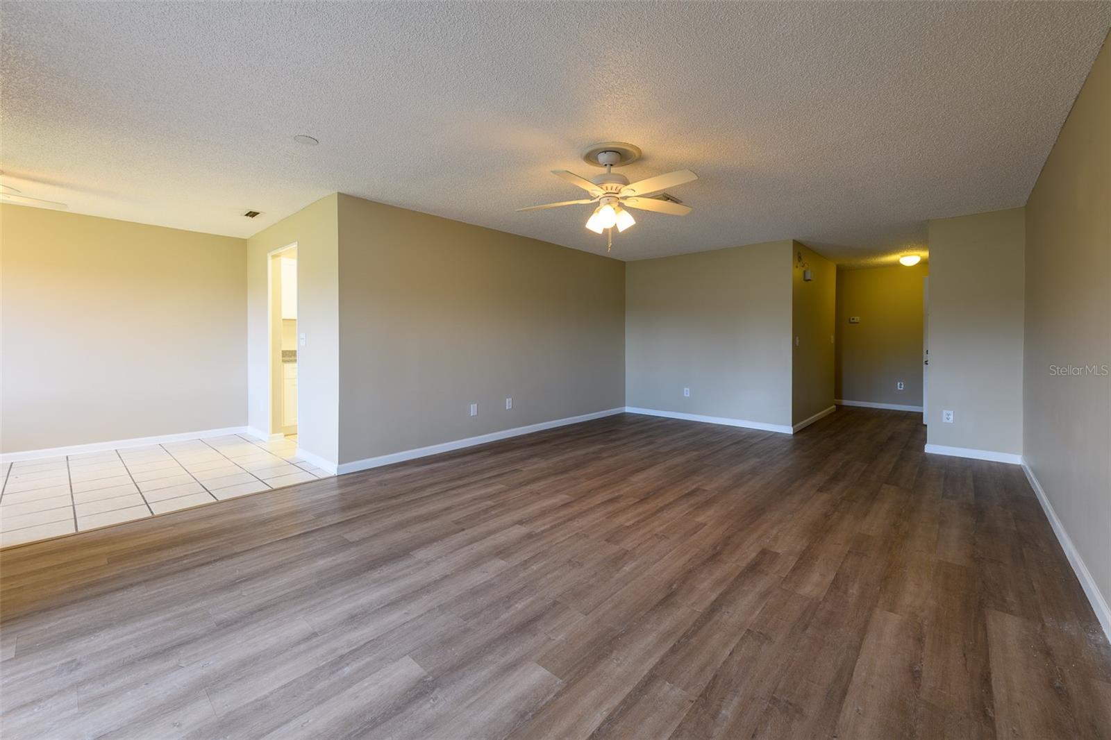 Living room view from sliding glass door, that leads to enclosed porch.