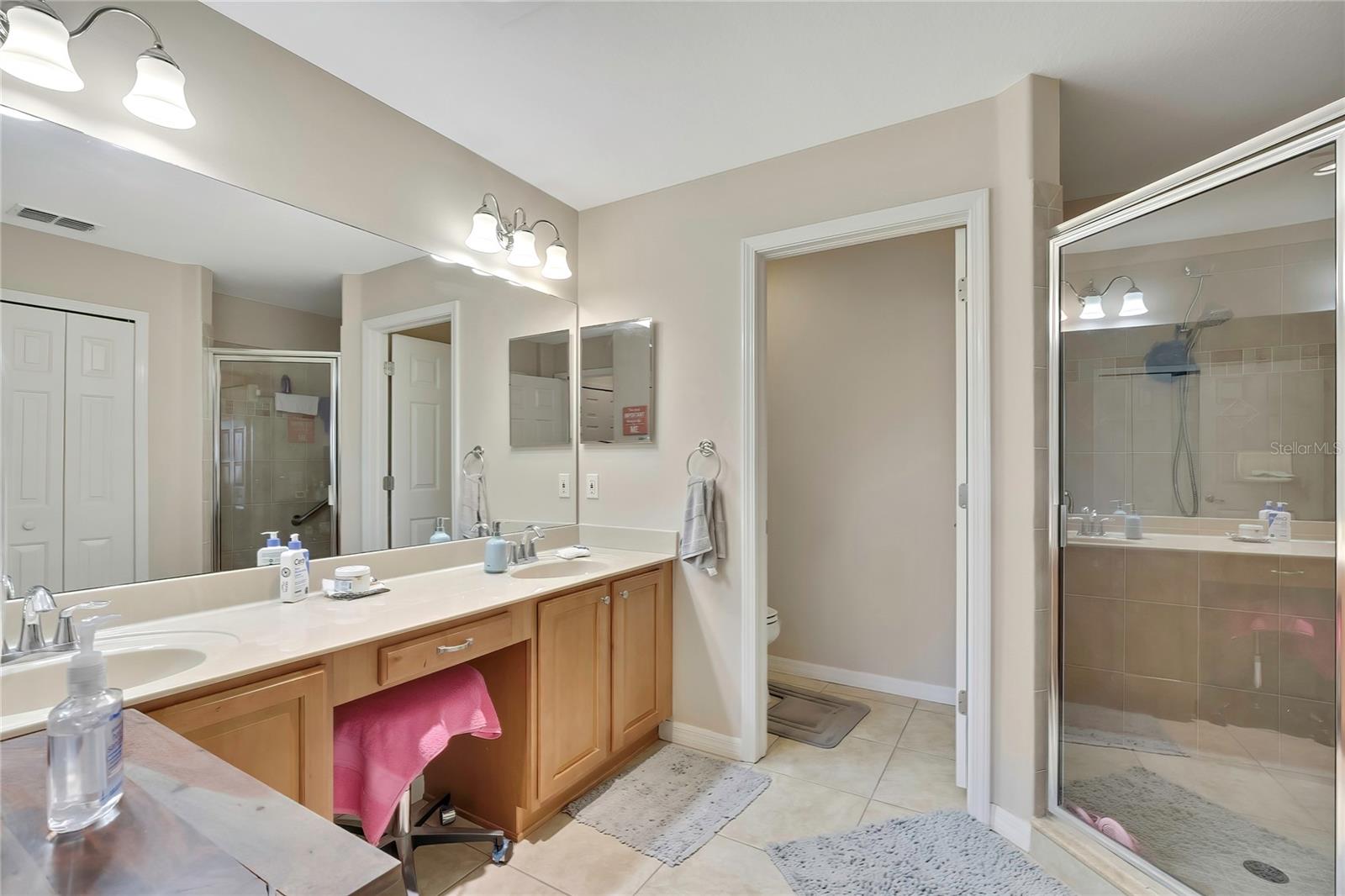 double sinks, water closet and shower