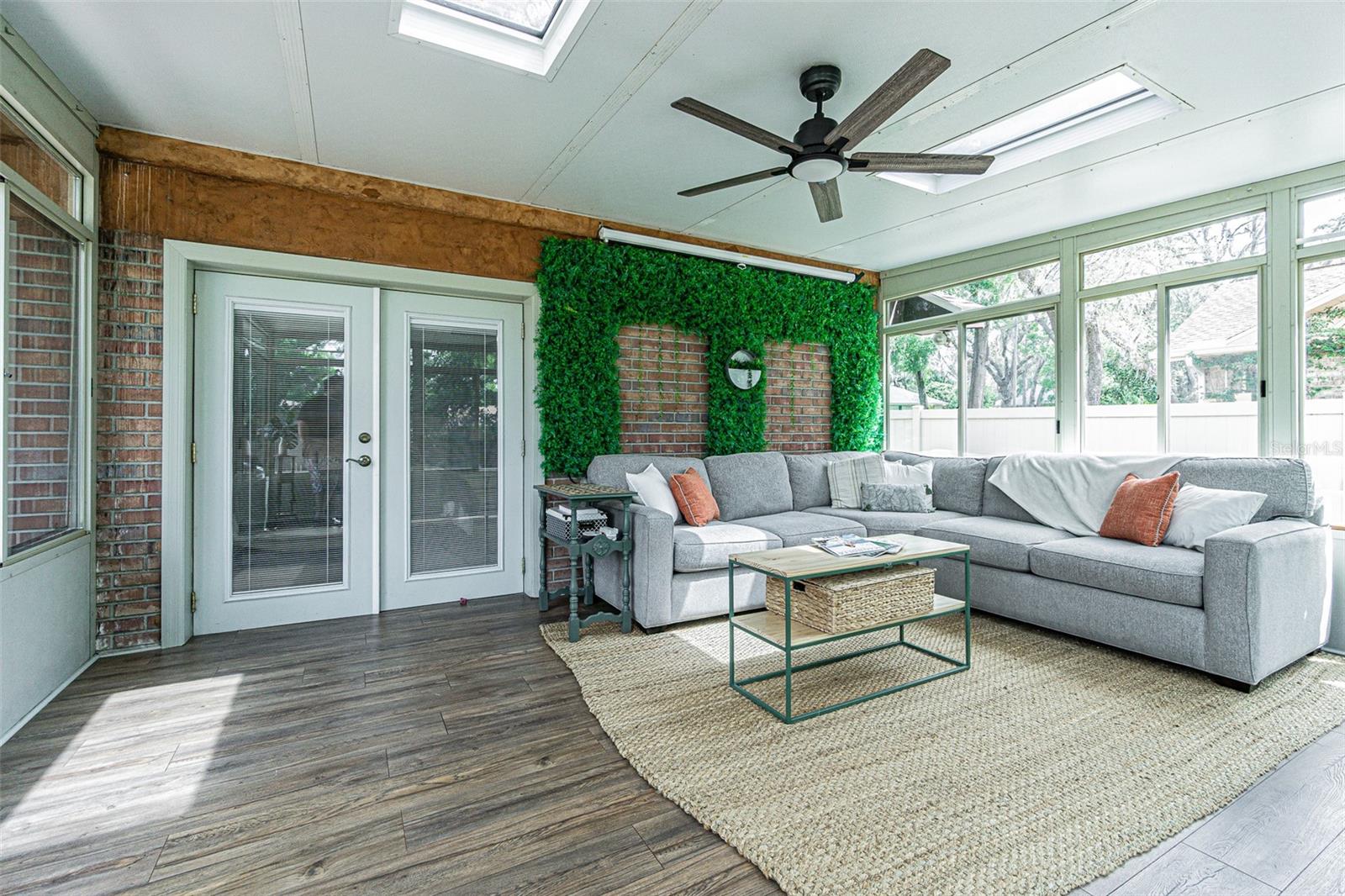 Florida Room with French doors leading to the primary suite.