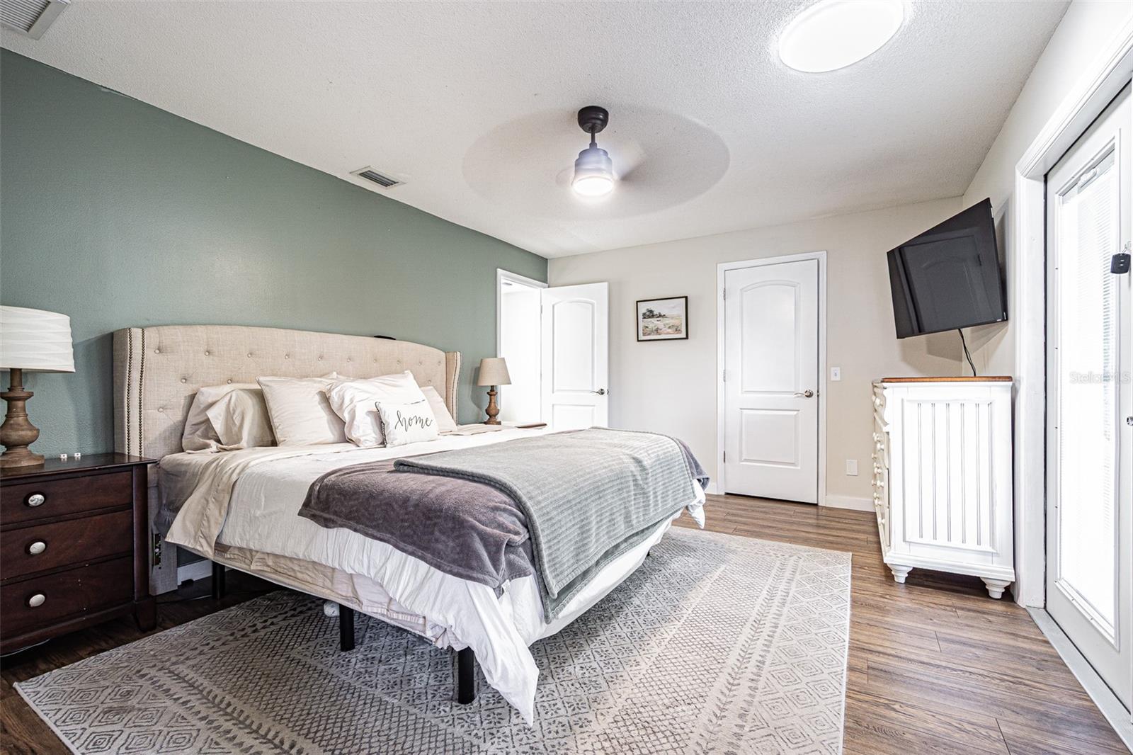 Primary Bedroom with French doors leading to the Florida room.