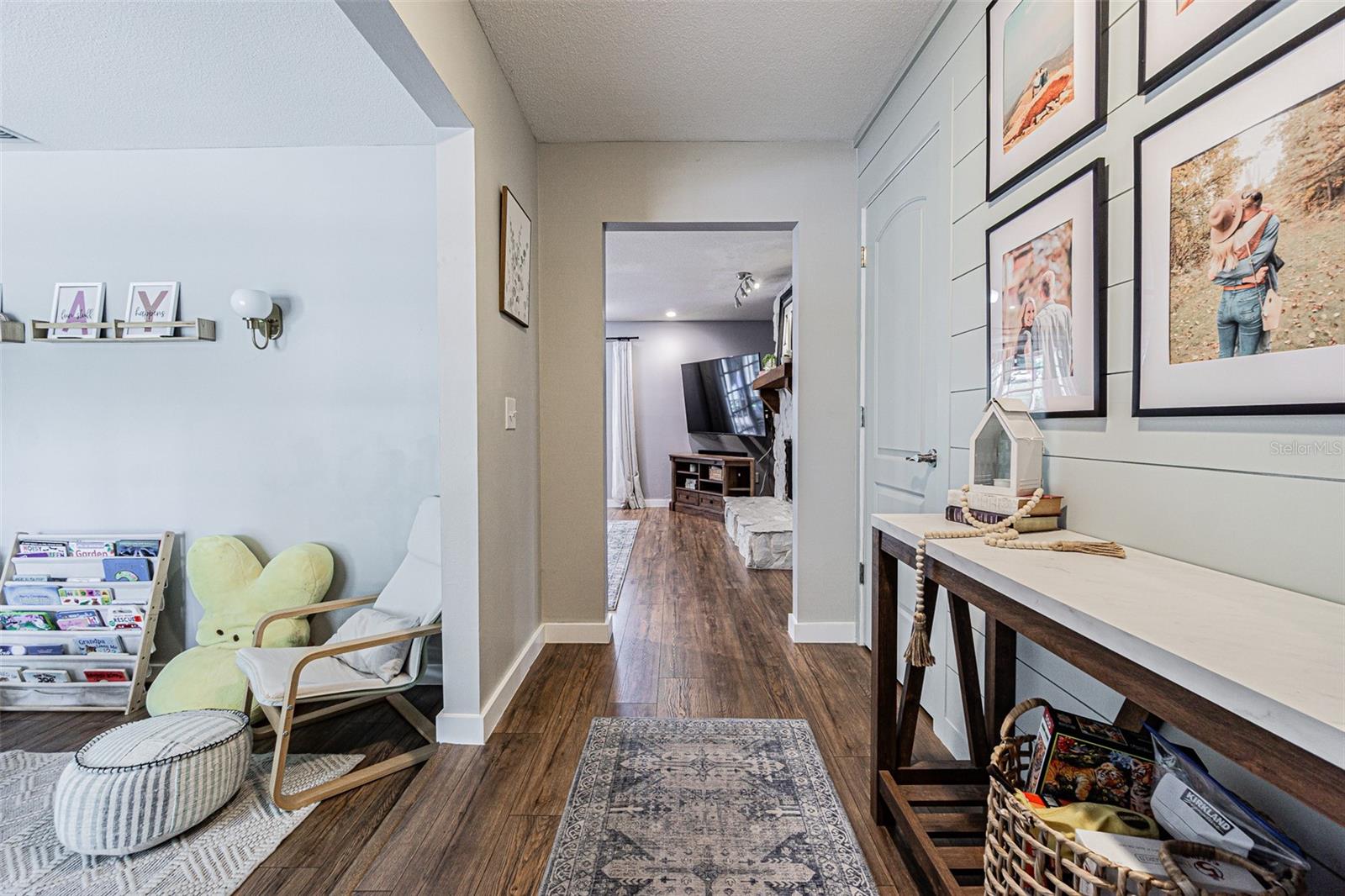 Foyer with the Living room to the left and the Family room straight ahead.