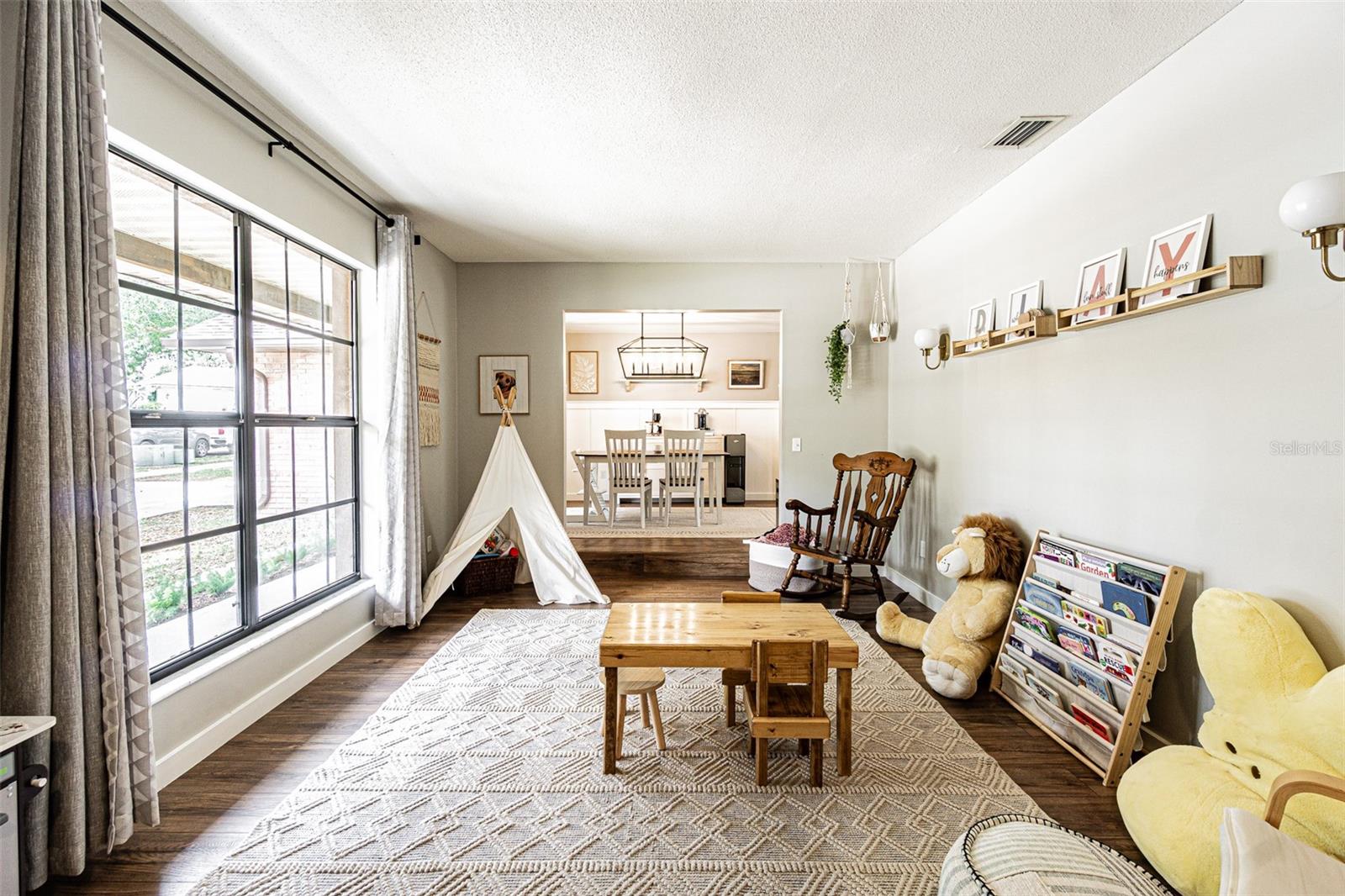 Living room with Dining room beyond.
