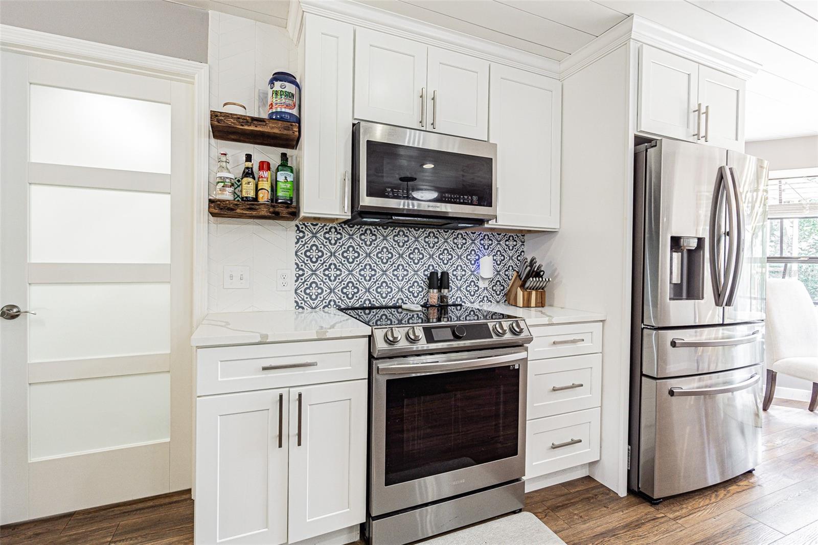 Kitchen with custom tile backsplash.