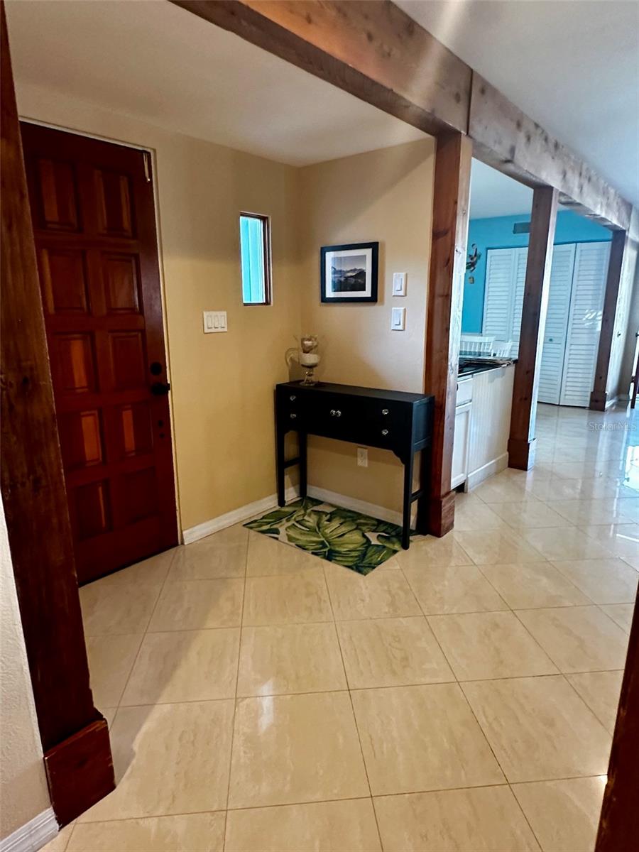 Front door entryway looking into kitchen and family room