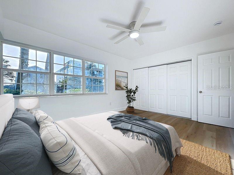 PRIMARY BEDROOM WITH WATER VIEW