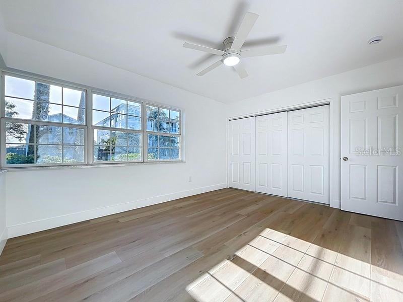 PRIMARY BEDROOM WITH WATER VIEW