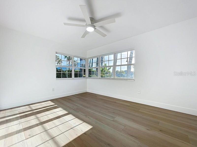 PRIMARY BEDROOM WITH WATER VIEW