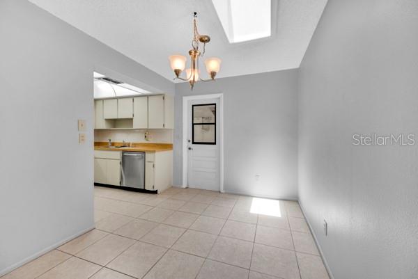 DININGROOM INTO KITCHEN WITH SKYLIGHT VIEW