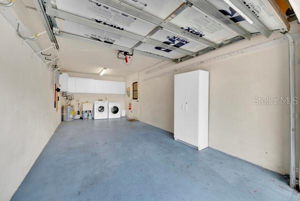 SPACIOUS ONE CAR GARAGE WITH STORAGE WASHER DRYER TOO