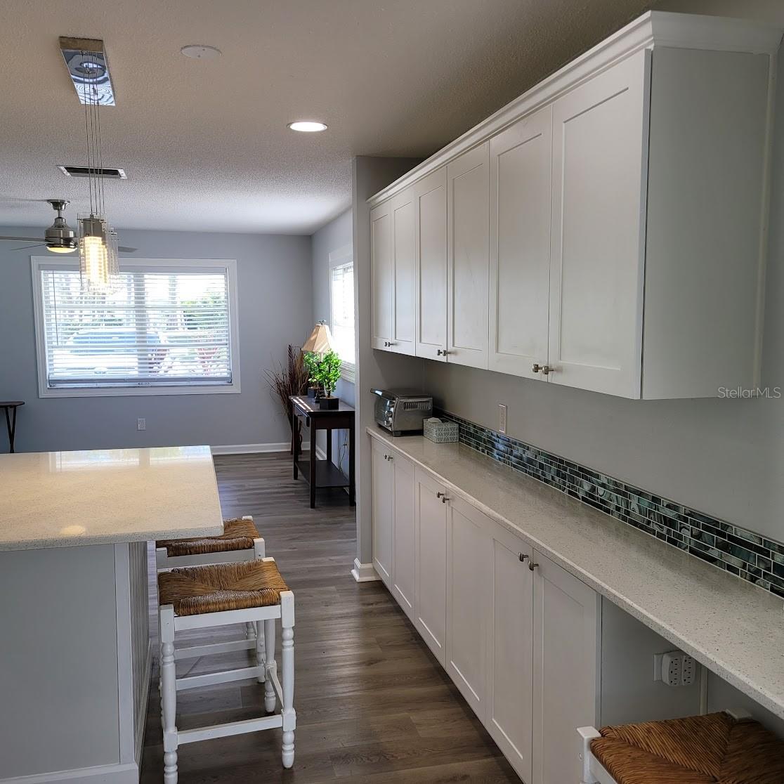 This wall of cabinets along with the additional counter space helps to ensure that there is plenty of storage in this home. "A place for everything and everything in it's place".