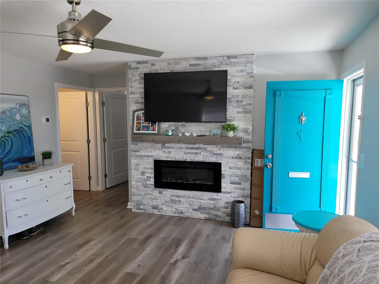 Different angle of the living room and fireplace from when it was furnished.