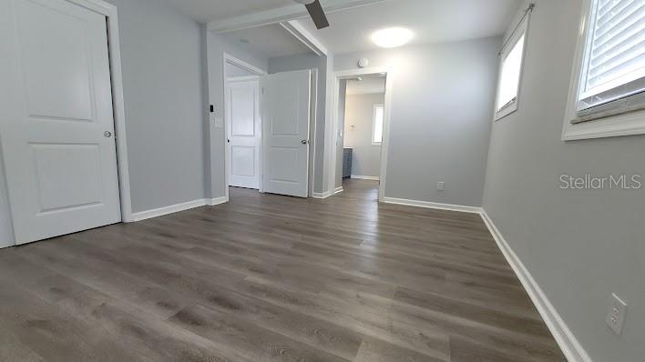 The opposite view of the Primary bedroom shows the entrance to the Primary ensuite Shower / Dressing Area + a walk in closet for storage.
