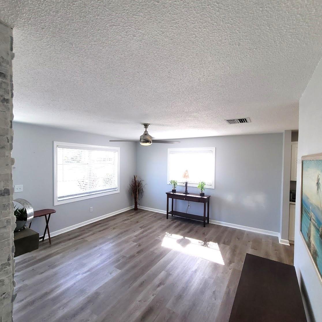 Leaving the Primary Suite area, takes you to the living room. Just outside this bedroom is the guest bathroom and also a hall closet.