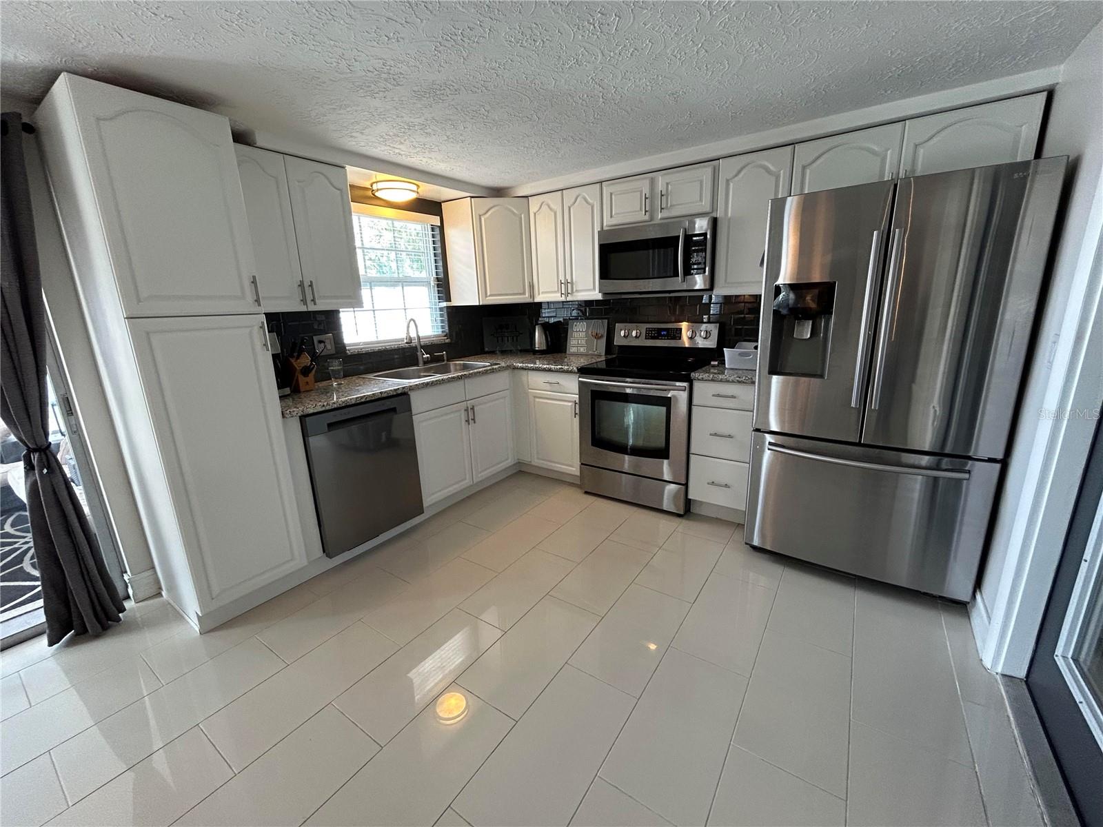 Completey updated with subway tile and stainless steel appliances.
