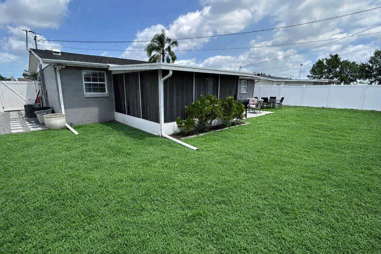 Plenty of space for entertaining and spacious fully vinyl fenced backyard.