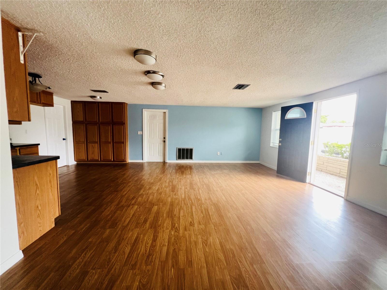 VIEW FROM ALL WAY LOOKING AT LIVING ROOM AND OPEN PLAN