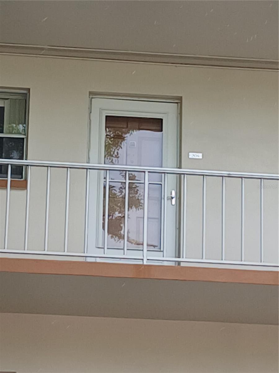 The front door with both doors closed from the ground.