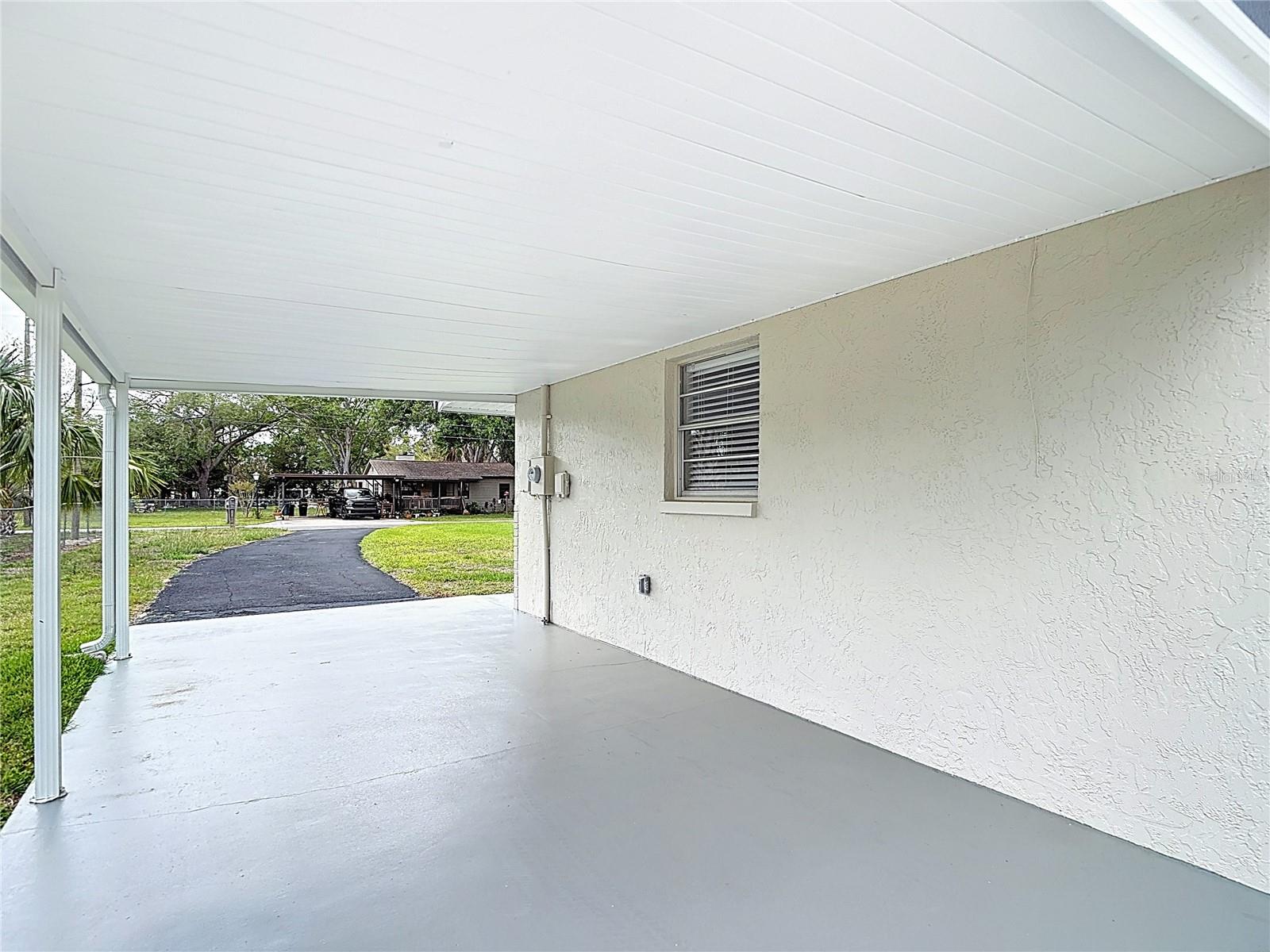 Carport with painted concrete floor!