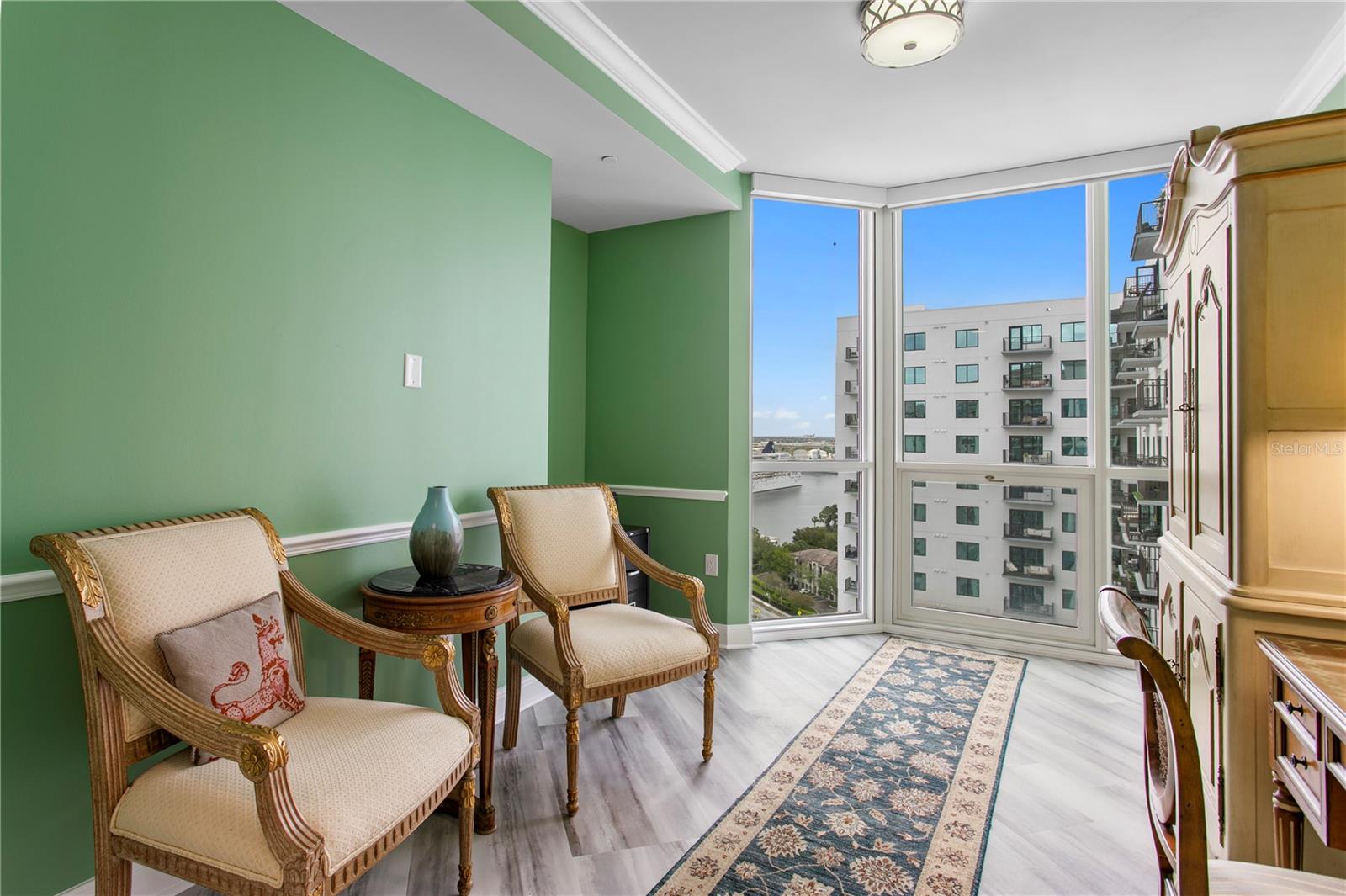 Well-appointed second bedroom with city views and ensuite bathroom