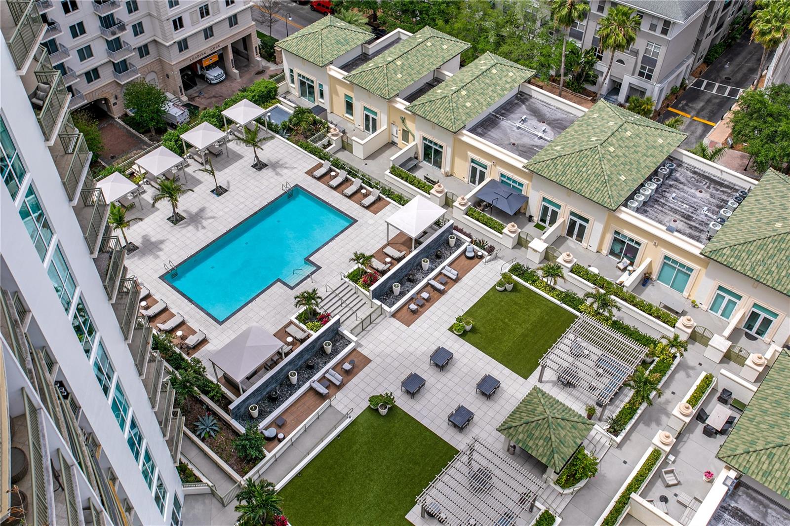 The Palm Court amenity level which features resort style heated infinity pool with hot tub, and pool-side cabanas.