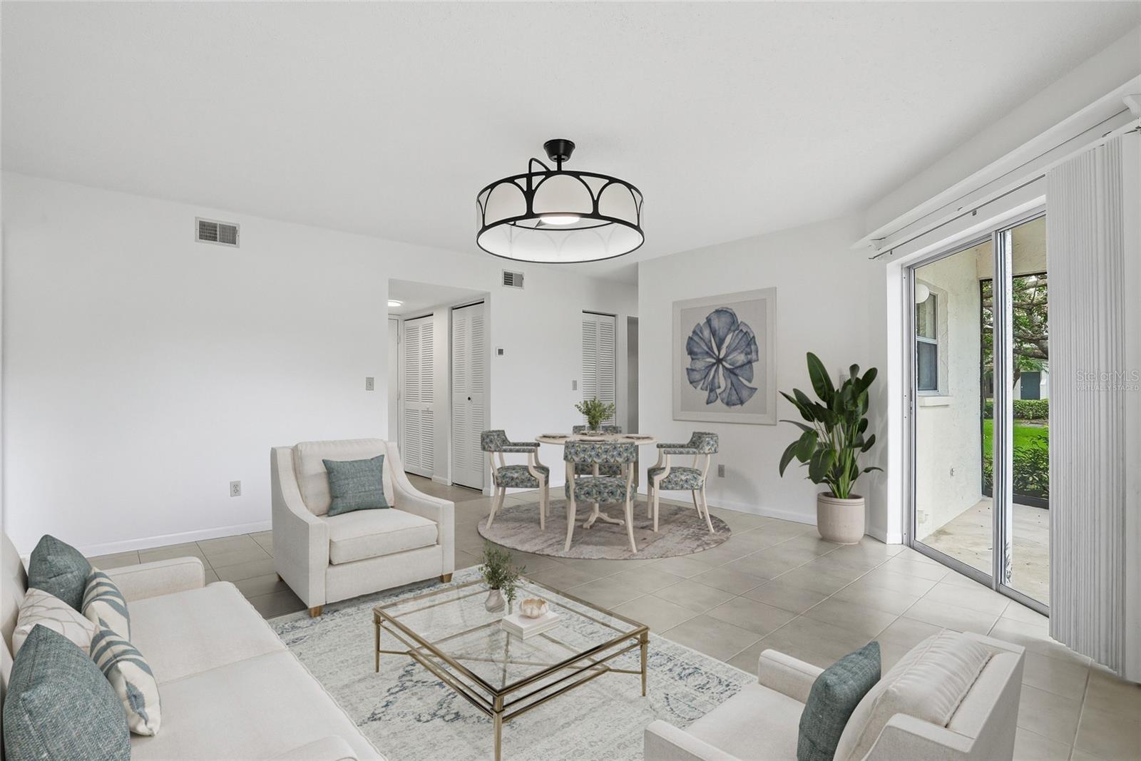 Virtually staged, light and airy living and dining area