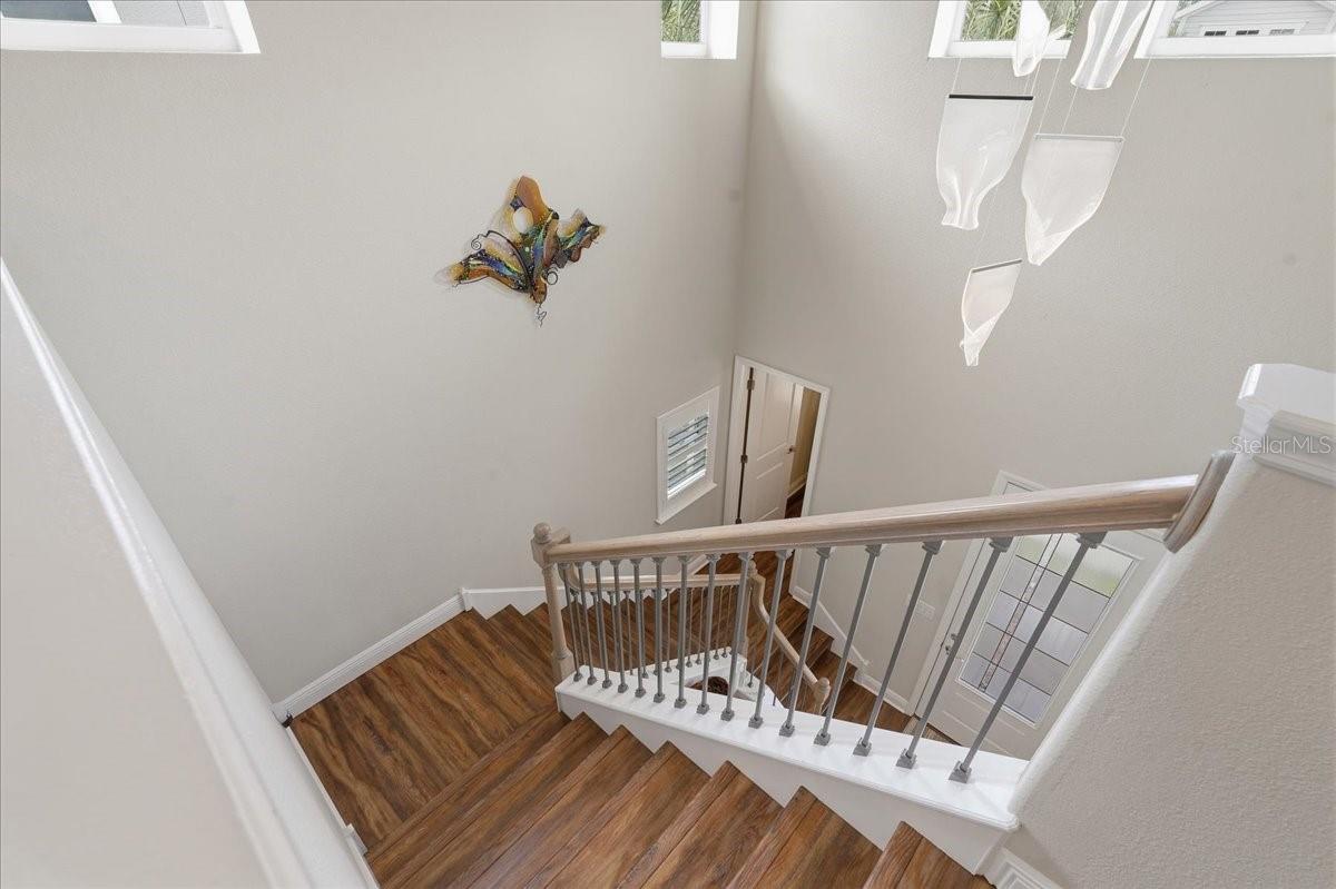 AMAZING FOYER LETTING IN NATURAL LIGHT WITH REMOTE CONTROL SHADES AND A VERY COOL CHANDELIER!