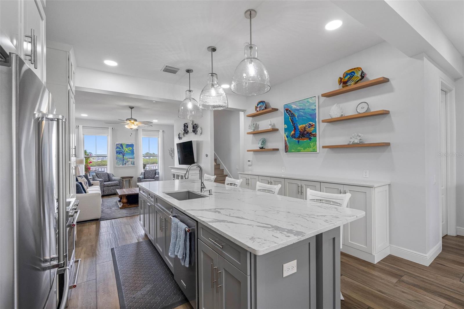.. Kitchen Looking out to Intracoastal. NOTE: 6 Display shelves above buffet cabinets..