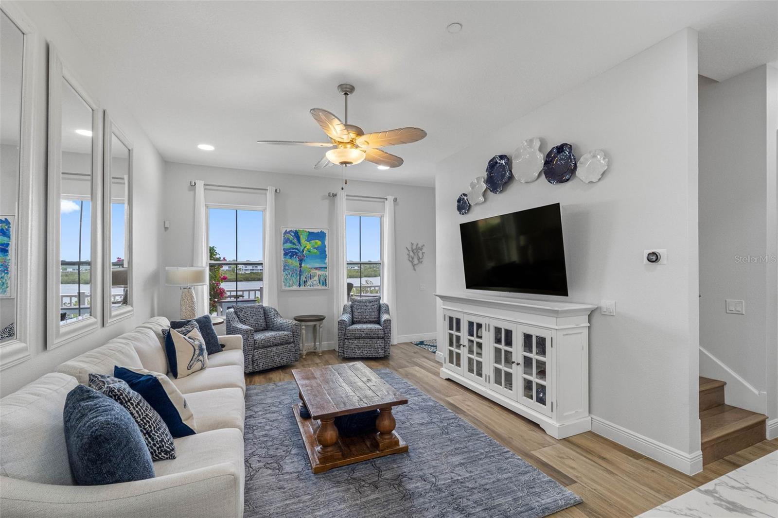.. Waterfront Living Area..Coastal Living is all about soft linen and seaglass. Sunsoaked brunches with old friends and new neighbors. Immediate Showings Available - Just Call..