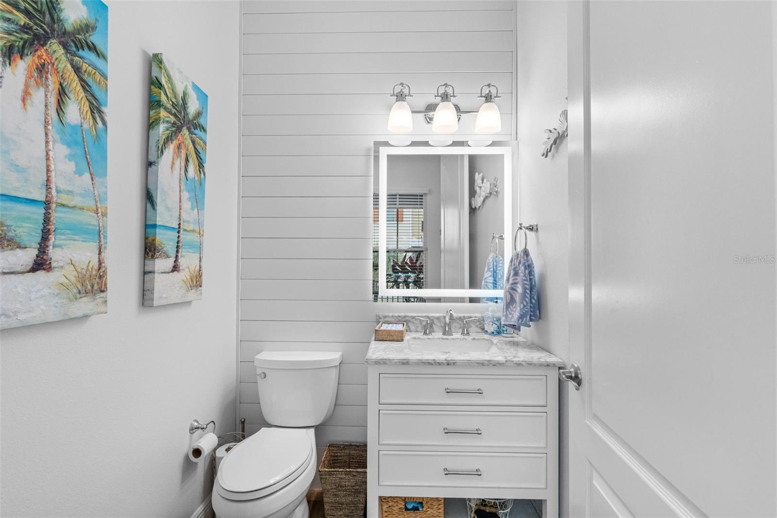 .. 1/2 Bath off  Dining  Area on Floor Level #2..  Half Bath remodeled with Comfort Height Toilet, Marble Top Vanity, LED Back-Lit & Front Lit Mirror..