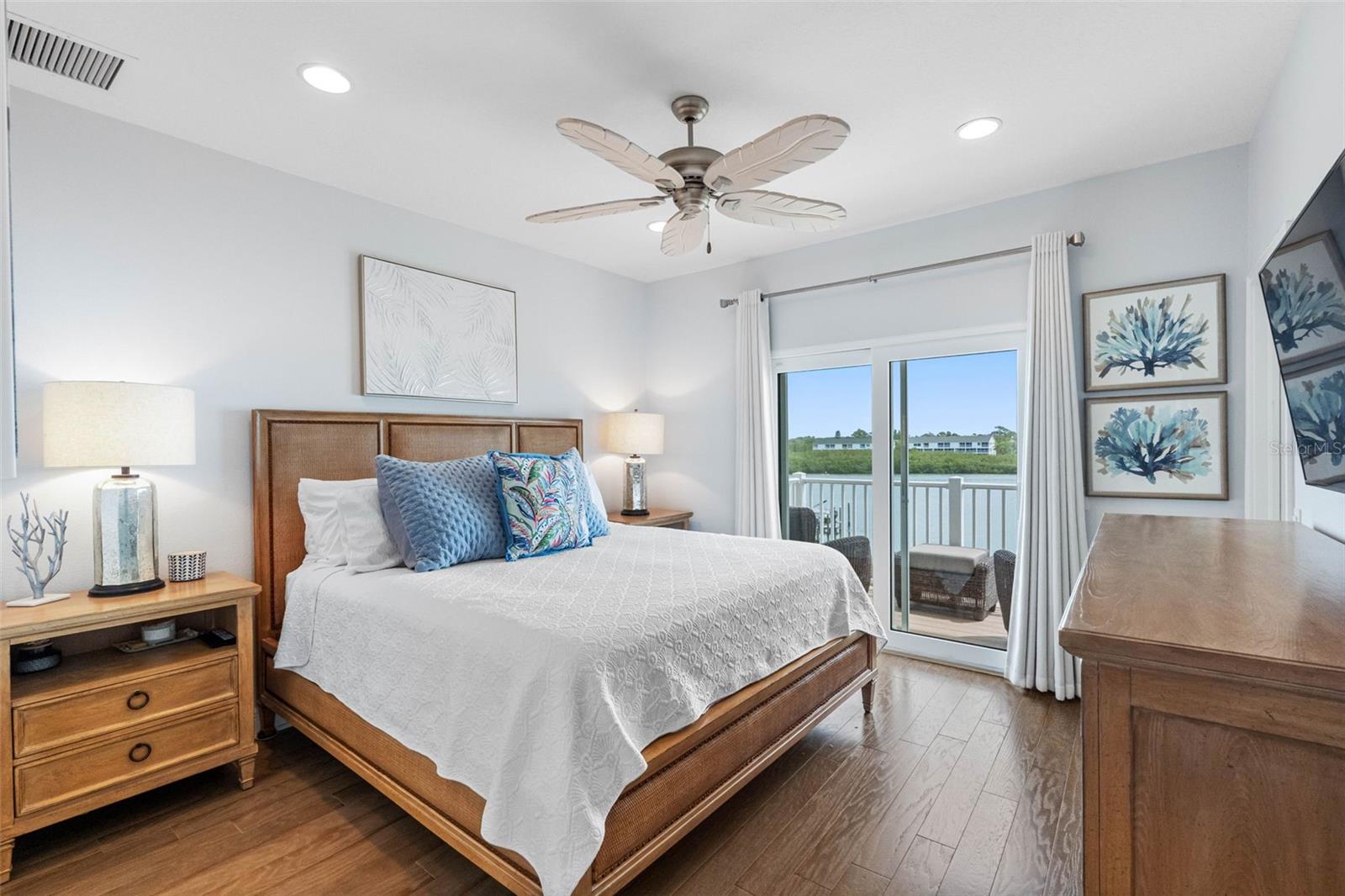 ...Waterfront Master / Primary Bedroom . Impact Sliders Open to 12 X 5.5 Balcony  Enjoy the Dolphins at Play by Your Doorstep..