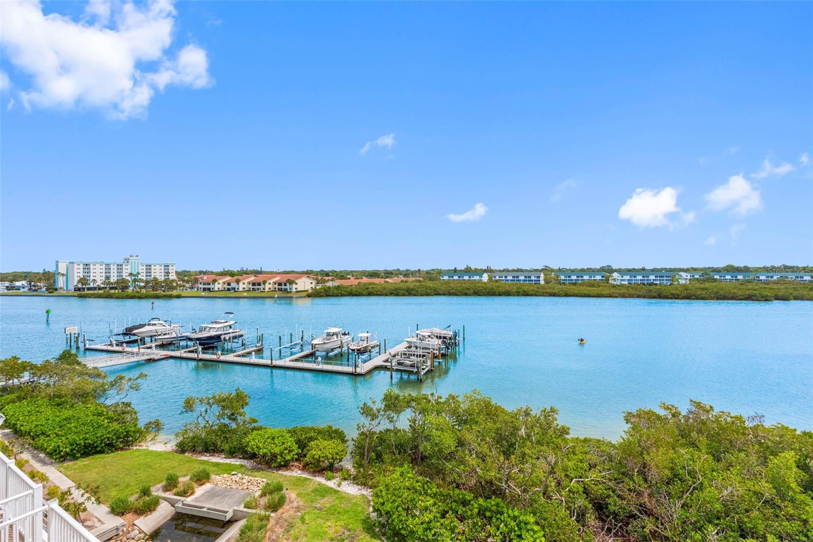 .. View Looking North East. Boat sliop #16 to Left. Black Boat in Slip . Jet Ski Lift Empty.