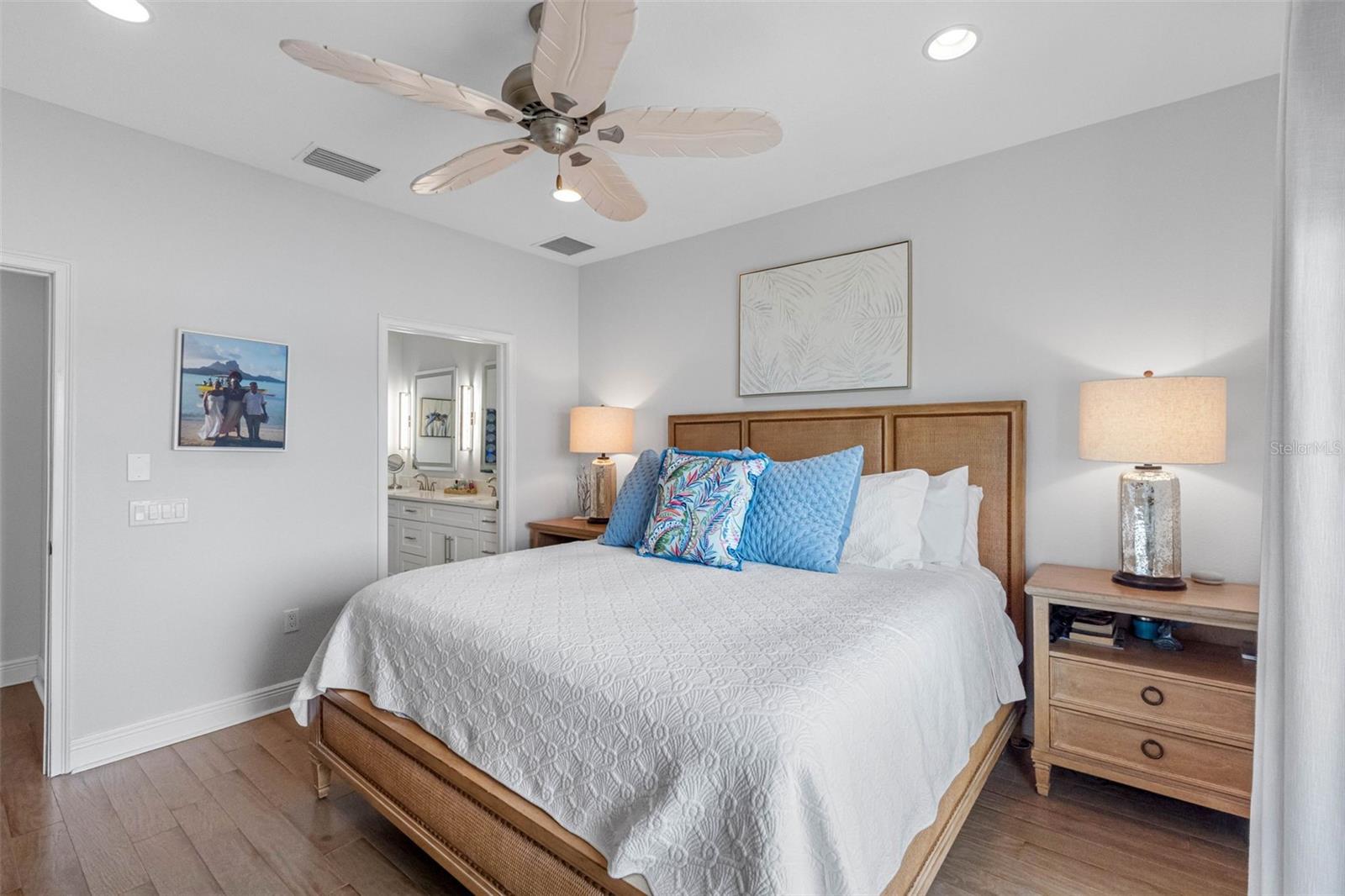 .. Master Suite Lookign In from Balcony Aera. Master Bath Thru Open Door.. Wood Floors on 3rd and 4th Levels. A little easier on the feet. Main Floor of Living has Porcelain Plank Tiling.