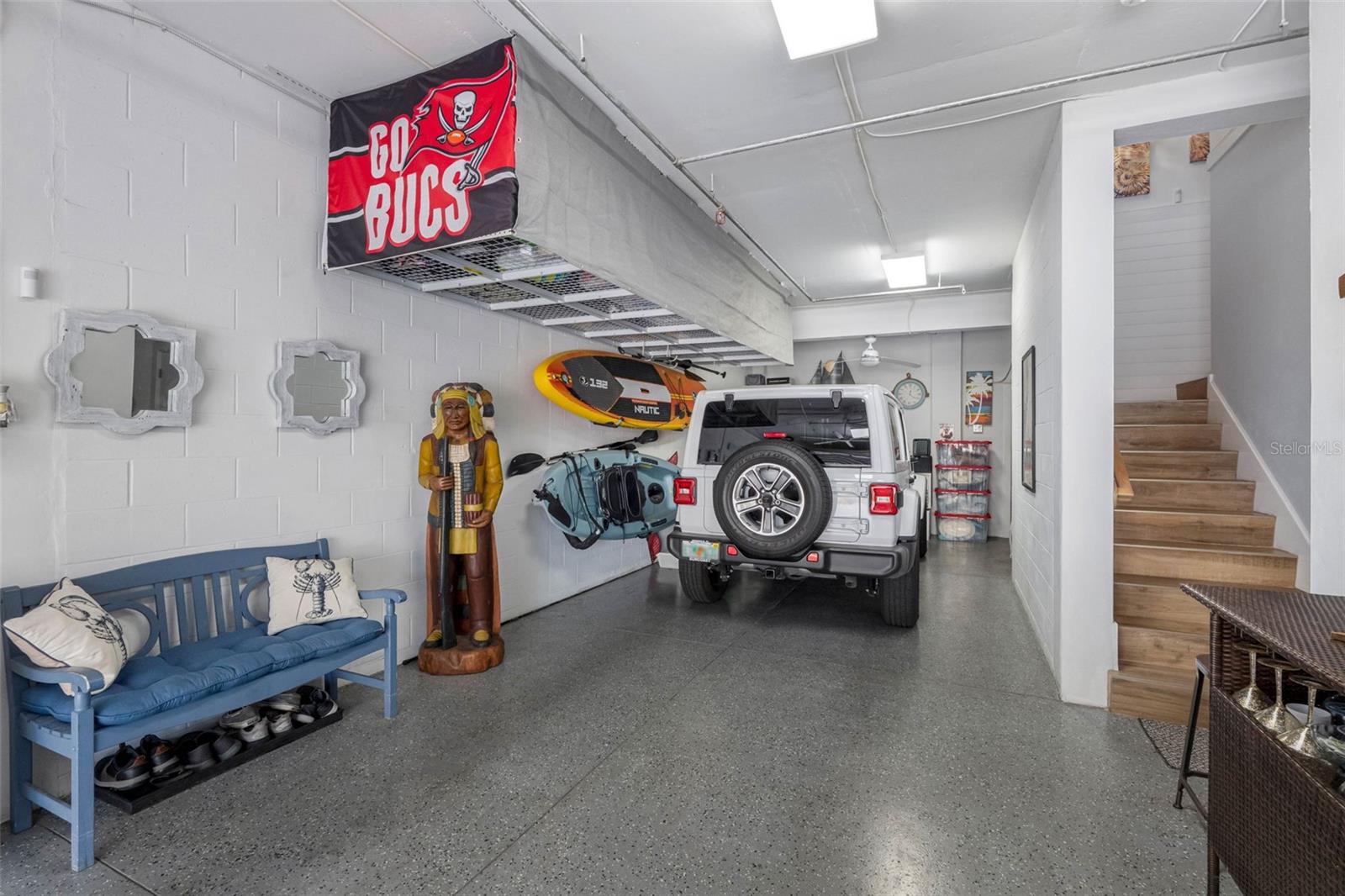 ... Stairs or Elevator from Garage Level. Garage Looking In..Garage Overhead Storage Racks. Extra Storage room in rear of garage. Owners had Developer add the extra room for storage,
