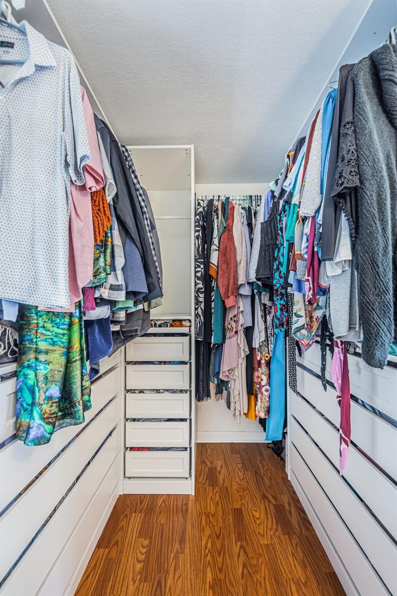 Primary bedroom walk-in closet
