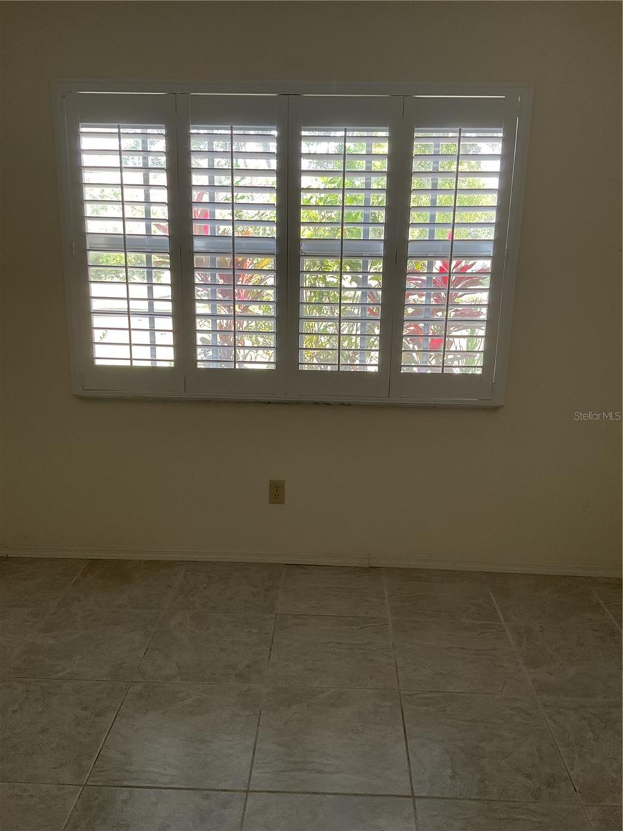 PRIMARY SUITE WINDOW WITH PLANTATION SHUTTERS