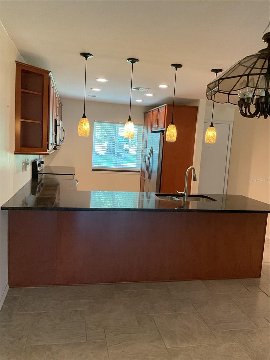 GRANITE COUNTERTOPS; PENDANT LIGHTS AND POT LIGHTS.  NEW WINDOW IN KITCHEN.