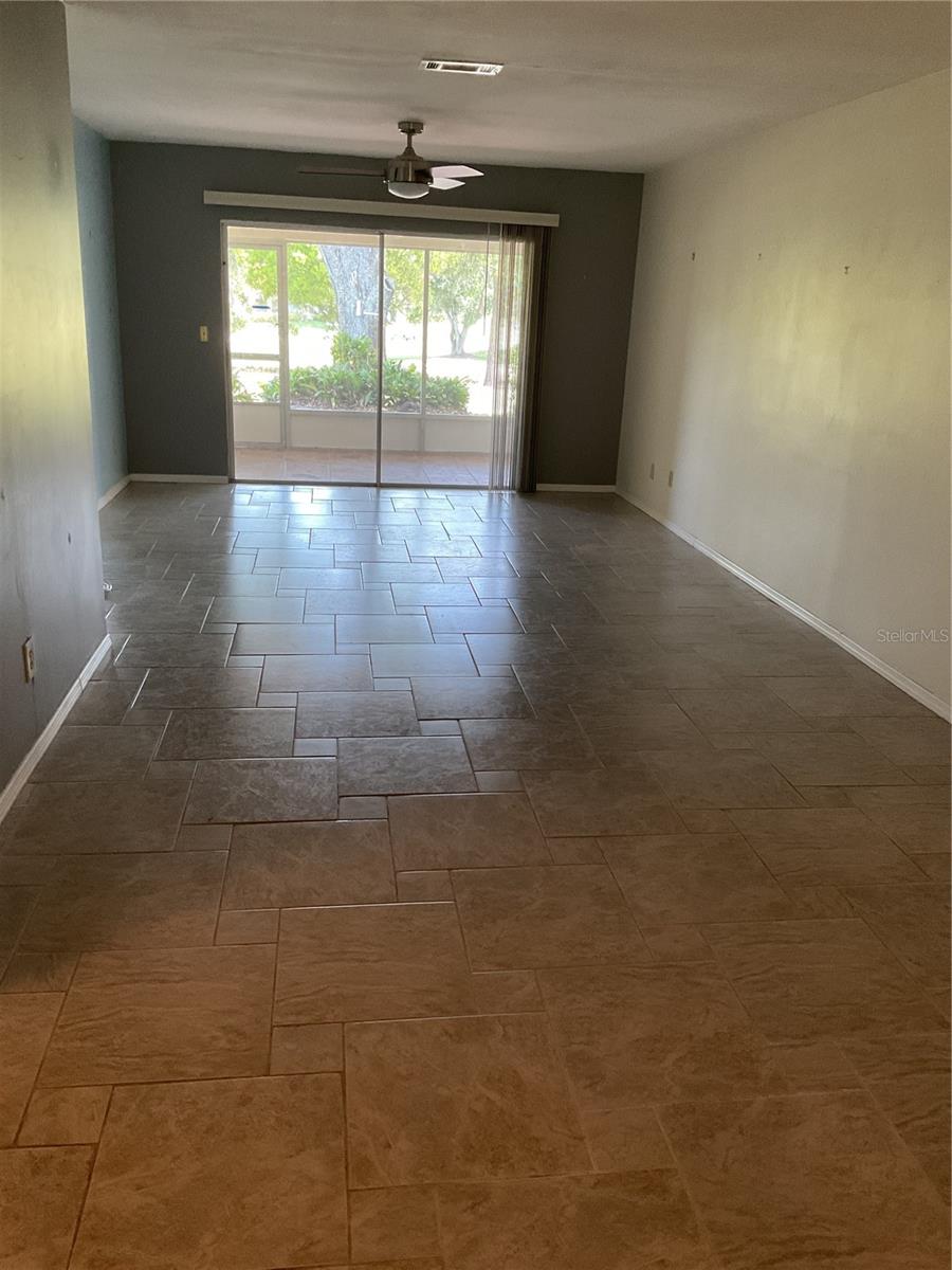 VIEW FROM KITCHEN INTO DINING ROOM/LIVING ROOM COMBO