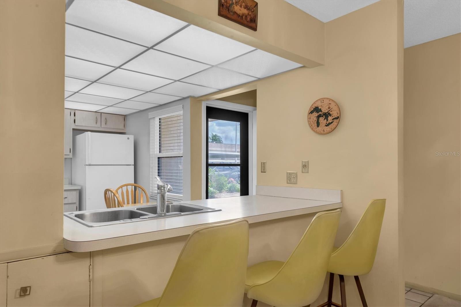 Breakfast bar overlooking Kitchen and Front door to the Unit