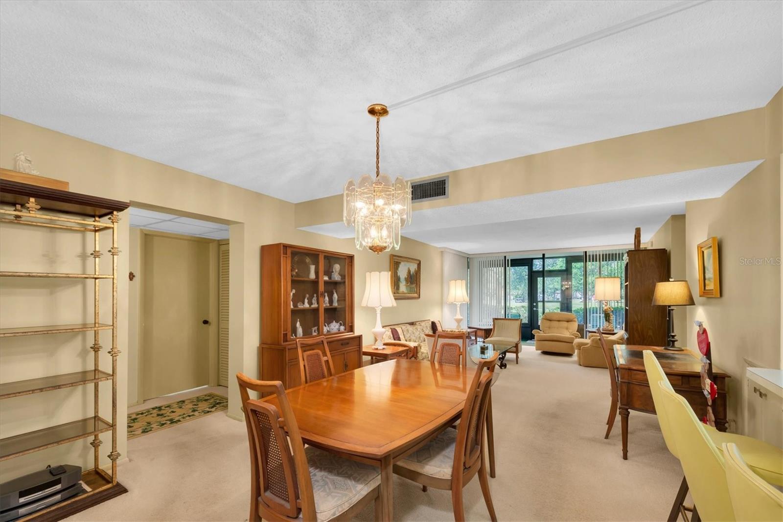 Dining Room looking into the Living Room with Bedroom 2 and 3 and 2nd Bath to the left