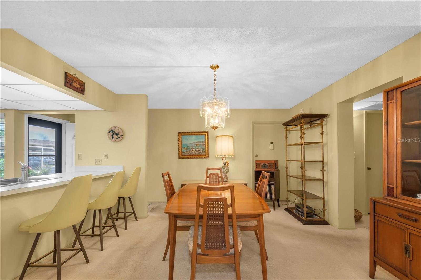 Dining Room with Breakfast Bar to the left.  Front entrance to the left