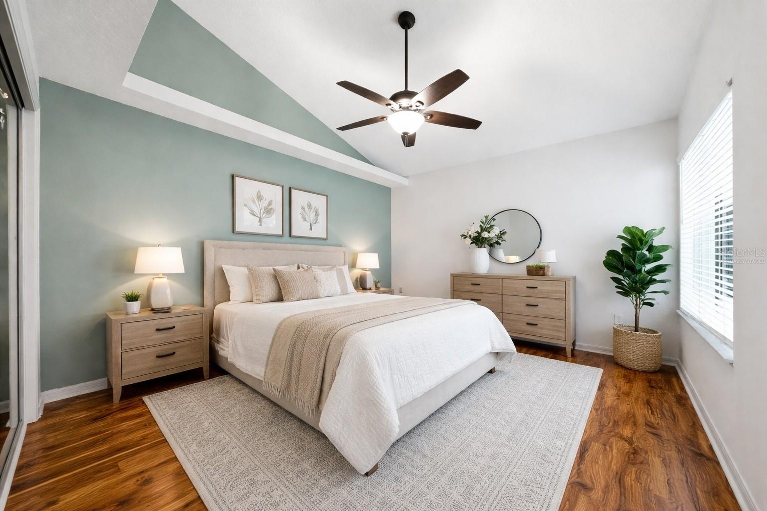 "Virtually Staged"  bedroom to the right after the hall way.