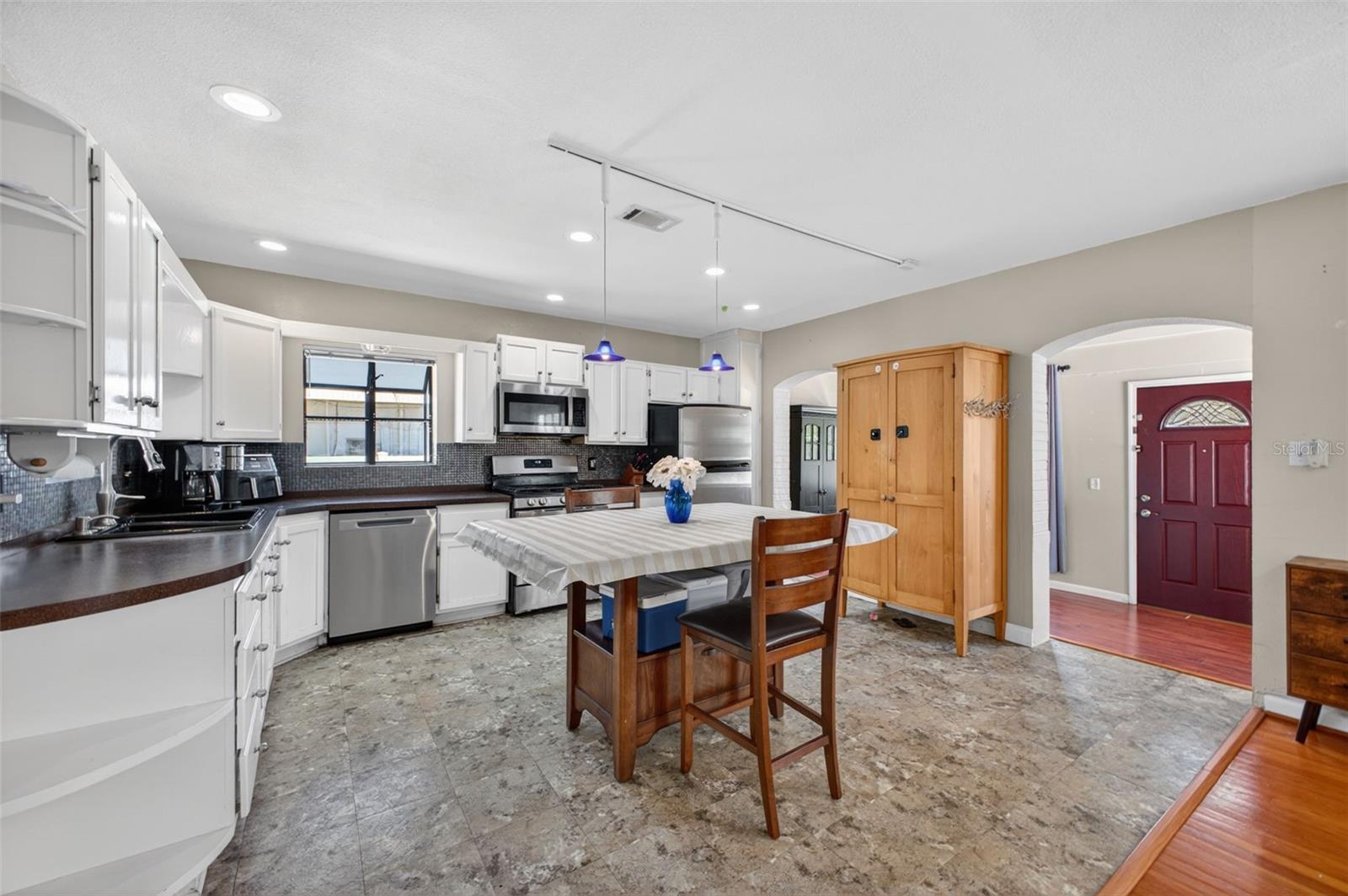 Clean, functional kitchen with ample cabinet space and natural light