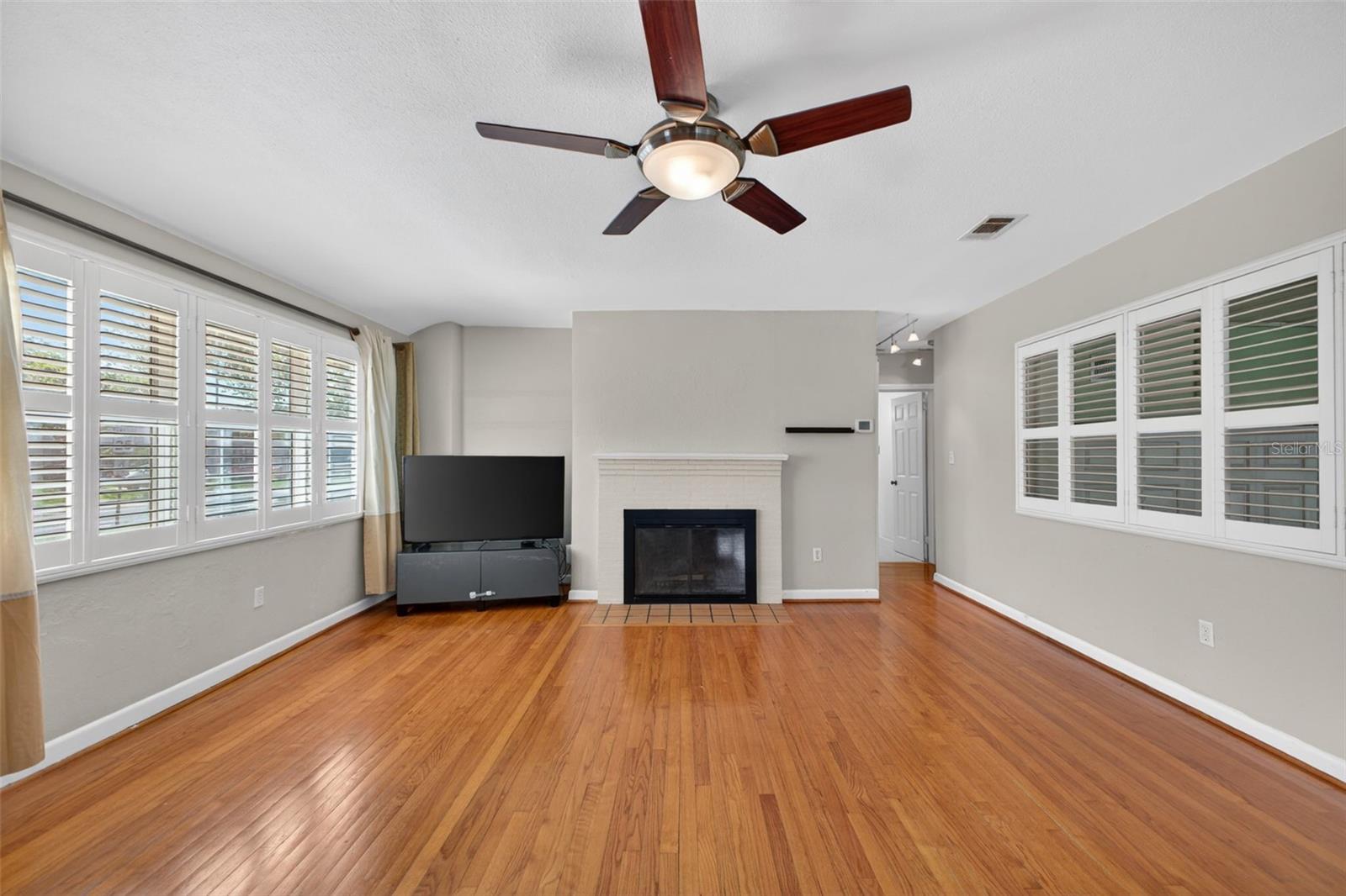 The living room is large and bright and can accommodate larger furniture