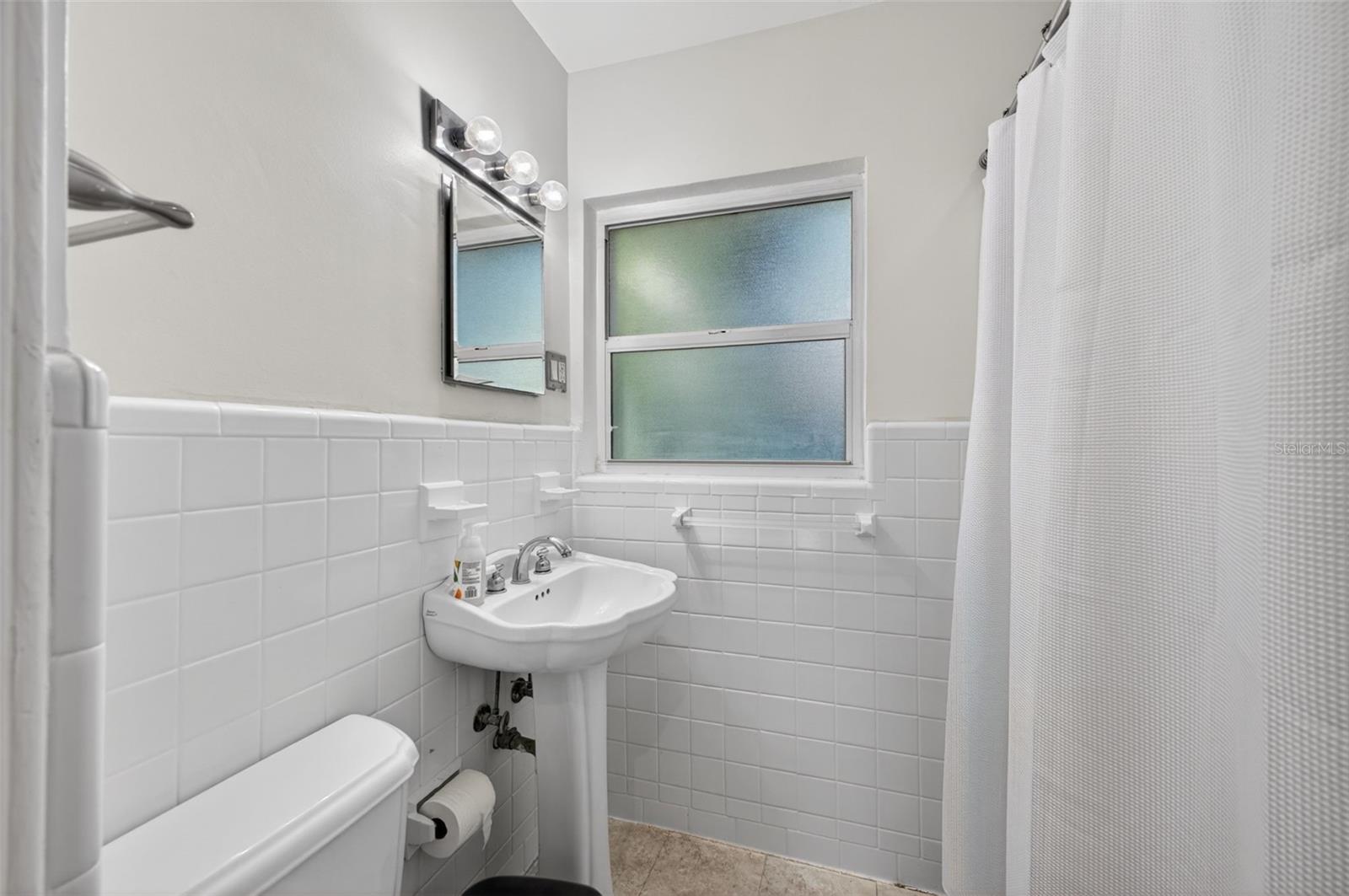 Updated bathroom with clean finishes and move-in ready feel
