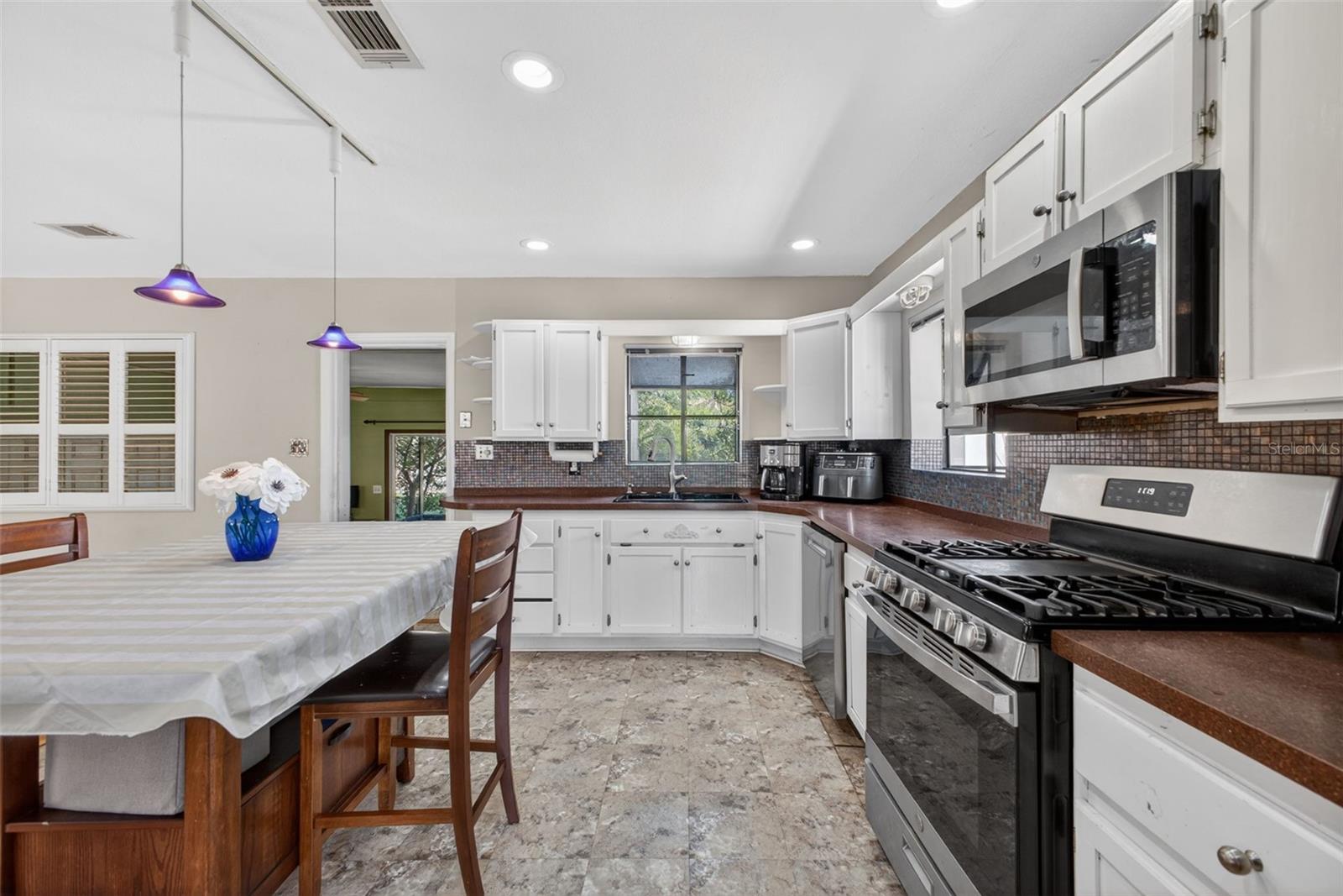 Open Floor Plan Kitchen with Center Island Table