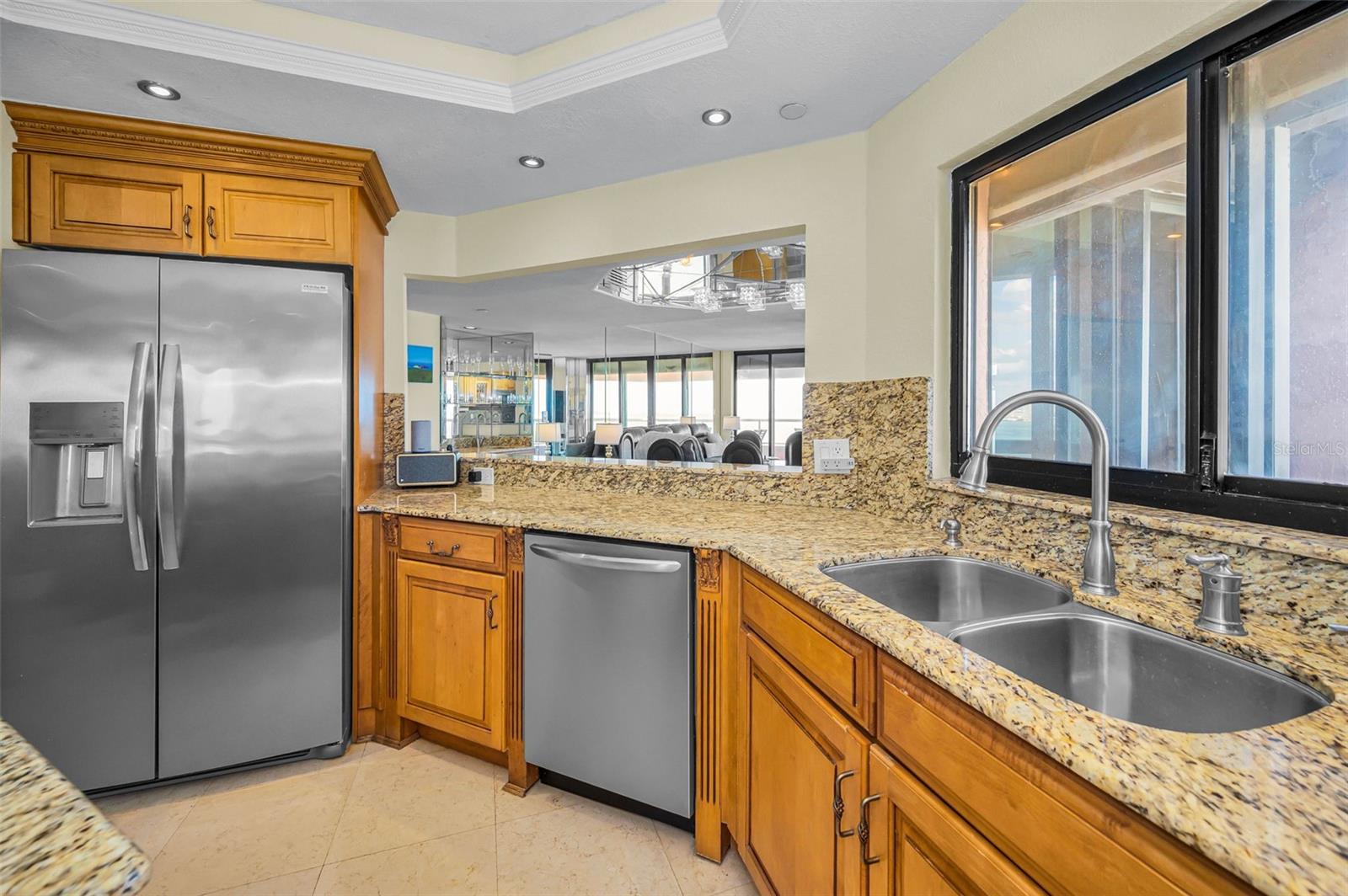 Cucina Features an Interior Ambiance Custom Cabinetry, Granite Surfaces, Bar Height Peninsula,Frigidaire Professional Series Stainless Appliances, Polished Travertine Floors and more!  Spacious Open Floor Plan with an Abundance of Natural Light, Terrace Access with Views from Every Room!